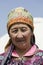Song Kul, Kyrgyzstan, August 8 2018: Portrait of a beautiful Kyrgyz woman wearing a hat at Song Kul lake in Kyrgyzstan