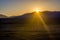 Song Kul lake with horses in sunrise