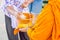 Songkran festival in Thailand, Hand woman use the water pouring to monk.