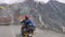 Sonmarg, Jammu and Kashmir - June 18 2019: A biker crossing th zojila pass at height of 11,000 feets