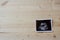 Sonogram on Wood Background