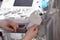 Sonographer holding ultrasound machine probe in clinic