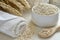 a soothing oatmeal bath preparation with colloidal oatmeal and a towel