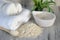 a soothing oatmeal bath preparation with colloidal oatmeal and a towel