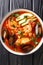 Sopa de Mariscos Seafood Soup closeup in the plate. Vertical top view