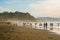 Sopelana Beach, Spain - August 16 2019: People walking on the beach. Beautiful sunset in Basque Country, north of Spain