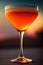 A sophisticated Manhattan with amber hues in a chilled glass, garnished with a cherry and orange twist.