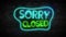 Sorry Closed Neon Light on Brick Wall. Night Club Bar Blinking Neon Sign