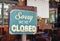 Sorry we are closed sign hanging outside a restaurant, store, office or other