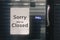 Sorry we are closed sign hanging outside a restaurant, store, office or other