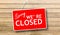 Sorry we are closed sign on wooden background