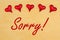 Sorry message with red glass hearts