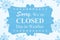 Sorry We`re Closed Due to Weather message on a wood sign