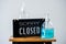 Sorry we\'re closed sign and sanitizer on table in cafe