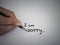 Sorry text concept write with black pencil on white background.