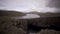 Sorvagsvatn lake over the cliffs in Vagar island establishing shot, sliding camera