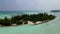 SOS sign on the sand at the beach at the tropical secluded island in Maldives. Aerial video