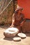 Sotho woman cooking maize meal