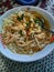 Soto Madura a Traditional Food from Indonesia, Noodles, Shredded Chicken, and Stock Broth, in one bowl