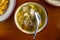 Soto Sapi. Beef Soto from Indonesian Traditional Food from Boyolali in white bowl and black wood table background.