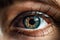 Soulful close-up of a young woman's eye in deep