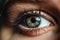 Soulful close-up of a young woman's eye in deep