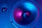 Sound audio speaker with neon lights. Dynamic monitor close up. Creative backgroound