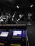 Sound Desk at Recording Studio, Band Rehearsing in B&W Background