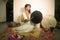 Sound healing and meditation therapy - attractive and elegant Asian Chinese healer woman playing drum at yoga studio as relaxation