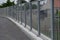 Soundproof wall of blue glass on a highway bridge embedded in metal beams, on the street. road traffic noise is reduced. safety pr