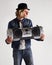 The sounds of a boombox. Studio shot of a handsome young man holding a boombox.