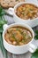 Soup with cabbage, mushrooms and chickpeas, closeup, top view