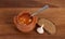 Soup in clay pot with bread and garlic