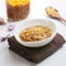 Soup of dried fried onion on white bowl on tablecloth