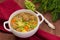 Soup with meatballs, carrots and peas. Wooden rustic background. Close-up