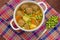 Soup with meatballs, carrots and peas. Wooden rustic background. Top view. Close-up