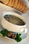 Soup with mushrooms in a bowl with a saucer