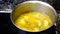 Soup with peas and potatoes boiling in the pot