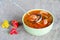 Soup with shrimp and vegetables, in a bowl and ladle. Selective focus