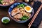 Soup with soba noodles, beef, ginger, green onions and egg.