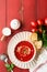 Soup. Tomato cream soup or gazpacho with herbs, seasonings, cherry tomato and parsley in white bowl on old red wooden background