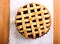 Sour cherry lattice pie over napkin