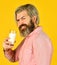 Source of calcium. Milk for good health. Lactose free. Bearded man hold glass of milk. Vegan milk concept. Drink protein