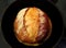 Sourdough bread in black pan
