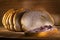 Sourdough slices freshly baked Sliced loaf of white bread on a chopping board light painting rustic style food