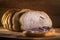 Sourdough slices freshly baked Sliced loaf of white bread on a chopping board light painting rustic style food