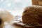 Sourdough unleavened natural sesame bread on wooden cutting board. Loaf of bread. Beige food background. Copy space