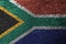 South Africa flag is depicted on the screen with the program code. The concept of modern technology and site development