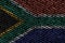 South Africa flag is depicted on the screen with the program code. The concept of modern technology and site development