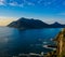 South Africa Hout Bay Cape Town blue hour scenic, idyllic landscape and seascape with a sunset over a blue calm sea with mountains